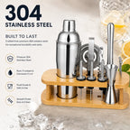 Complete 17-in-1 RüK cocktail shaker set arranged neatly on bamboo stand, including shaker, jigger, muddler, tongs, bar spoon, strainer, pourers, fruit picks, and corkscrew.