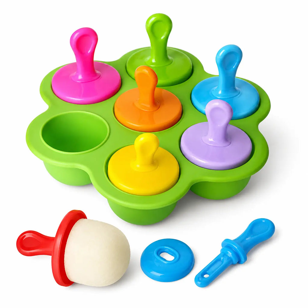 Top view of colorful popsicles in green mold
