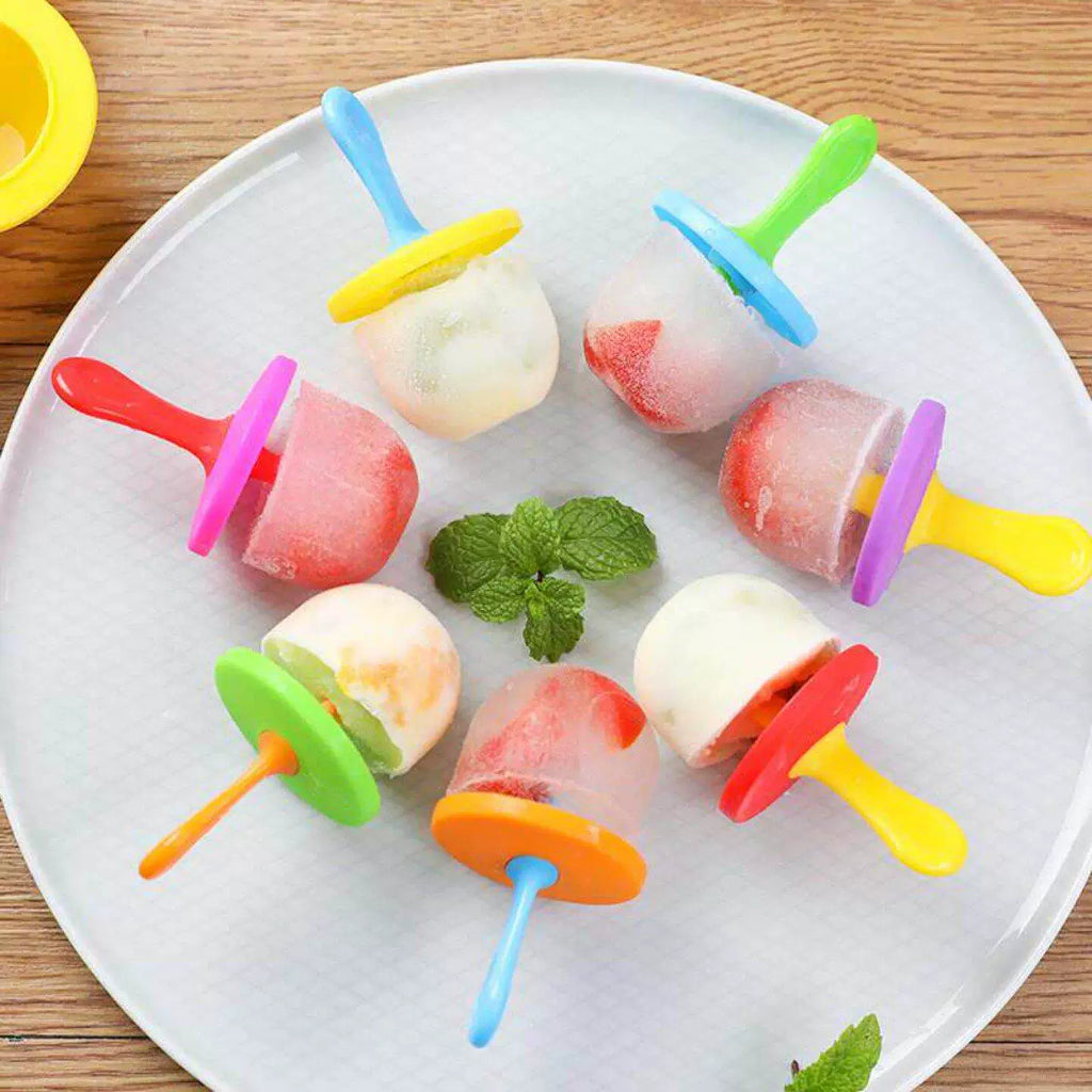 Popsicles being served with fresh fruits