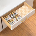 2 tier acrylic spice drawer organizer for neatly storing seasoning jars in a kitchen drawer