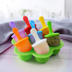 Silicone mini popsicle mold with colorful sticks placed in freezer for homemade ice pops