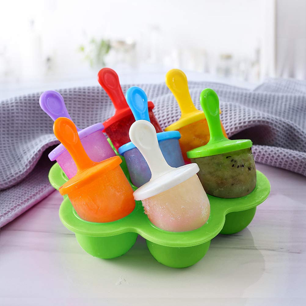 Silicone mini popsicle mold with colorful sticks placed in freezer for homemade ice pops