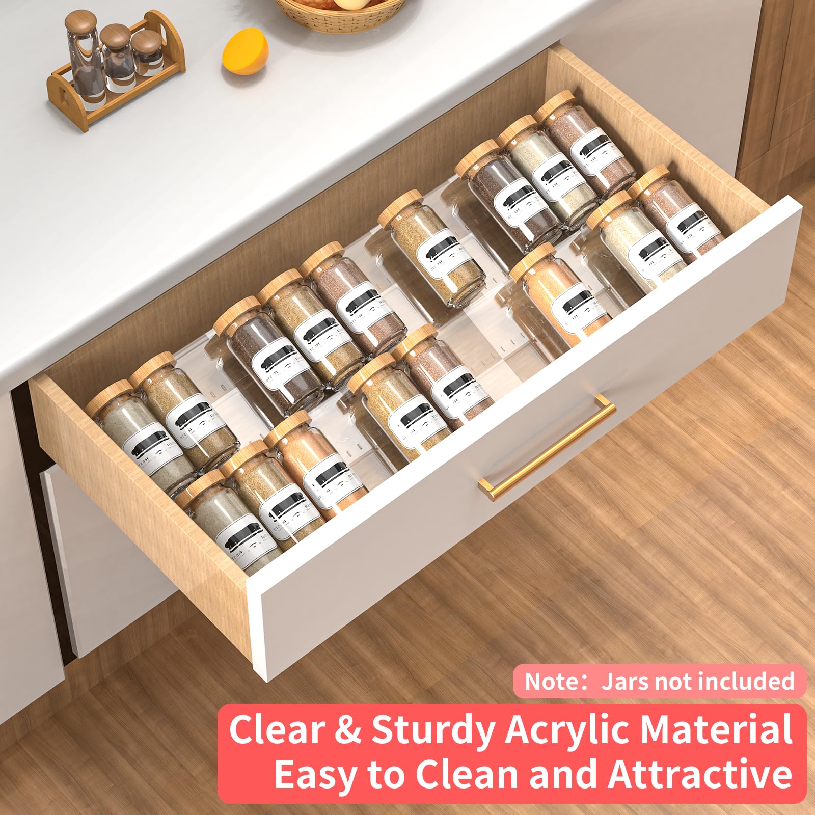 Clear acrylic seasoning drawer organizer holding spice jars neatly inside a kitchen drawer