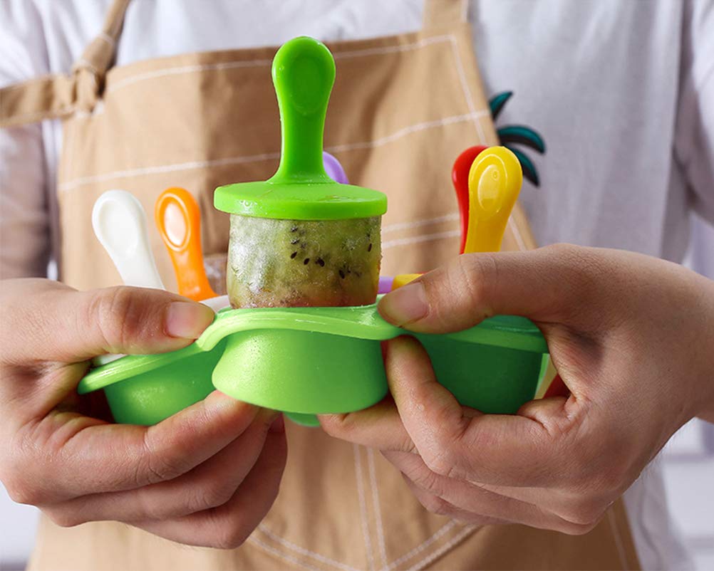 Flexible silicone popsicle mold held by hand for easy release of mini ice pops