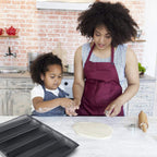 Family baking homemade bread together in the kitchen