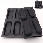 Flexible black silicone mini loaf pan with 12 cavities for easy bread release and storage