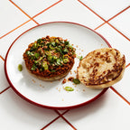 Homemade burger bun on plate showing sandwich use with silicone hamburger bun mold